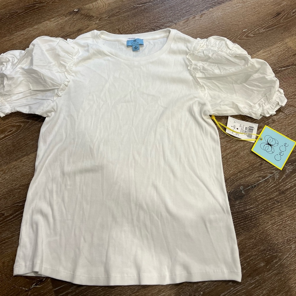 White T, very comfortable, wide shoulders, soft perfect size.